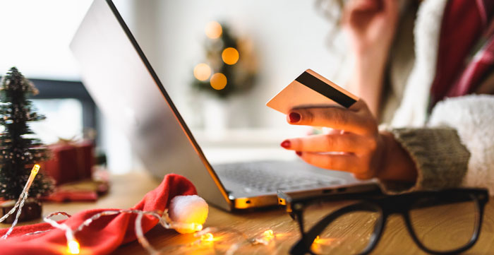 woman shopping on a laptop at christmas