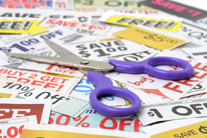 pile of coupons and a pair of scissors