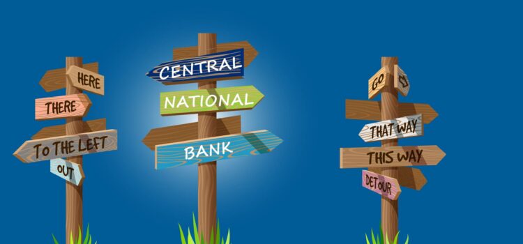 picture of several sign posts pointing directions to Central National Bank