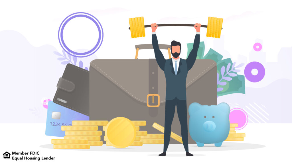Business man in suit holding weights over his head. Briefcase, piggy bank, cash, stacked coins, wallet and credit card all pictured in background showing that the weights themselves aren't the only goal