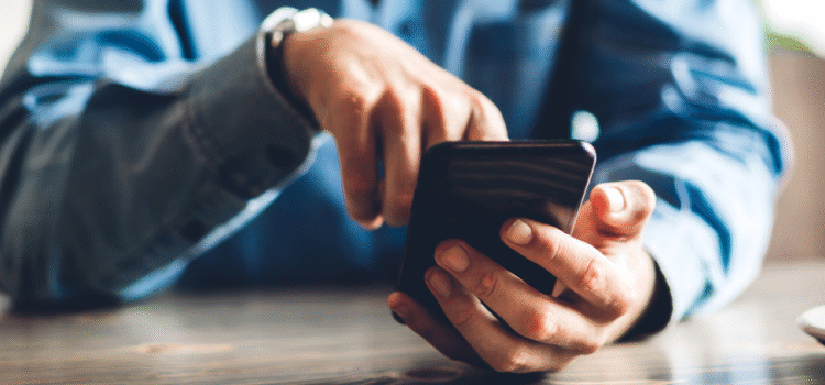 Person selecting something on his phone screen