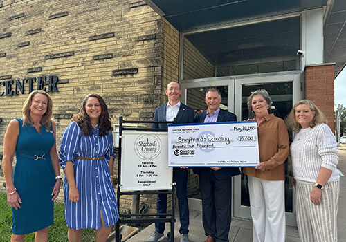 Central National Bank Donates $25,000 to Shepherd’s Crossing 25th Anniversary Campaign Representatives from Central National Bank present a $25,000 check to representatives from Shepherd's Crossing in Manhattan, Kansas